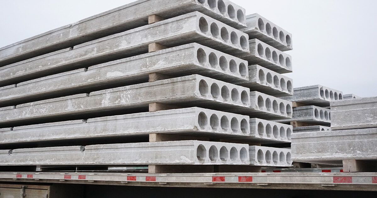 Hollowcore precast slabs loaded on a transport trailer.